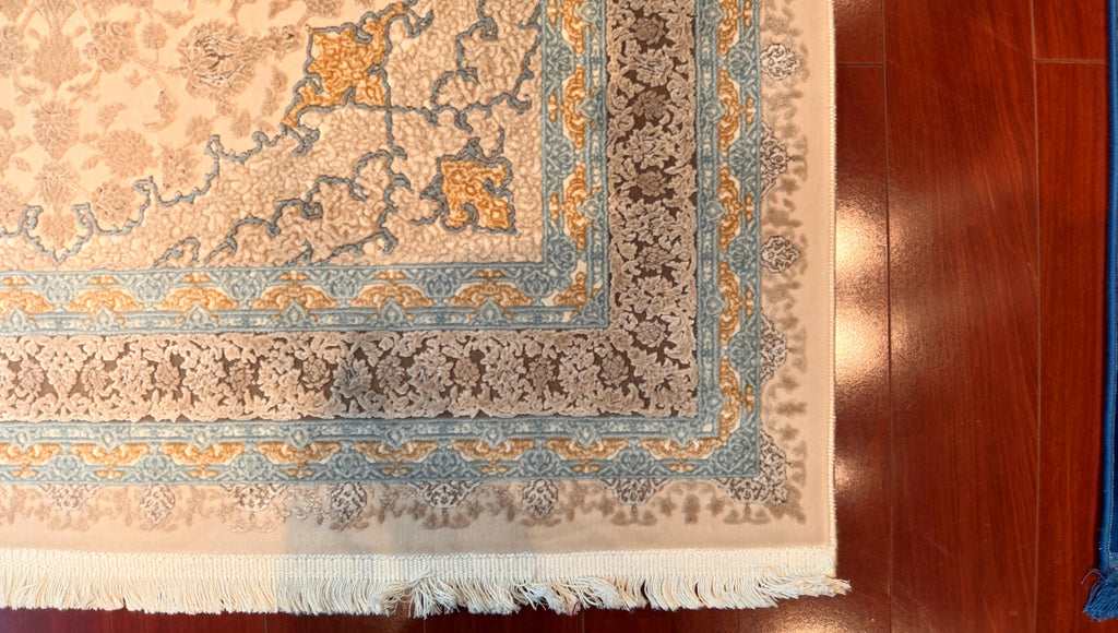 Close-up of a patterned rug on a wooden floor